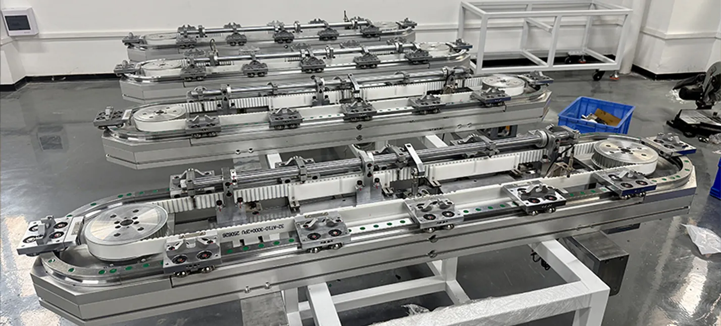 V-wheel driven circular track conveyor with precision positioning structure for automated inspection systems