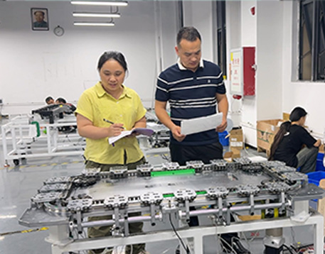 Zhenji Automation engineering team reviewing a custom automation project