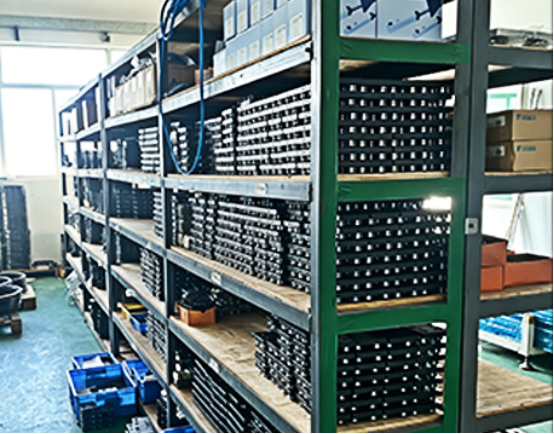 Stock storage rack close-up of circular linear guides and precision sliders.png